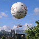 Hot air balloon floating above Paris