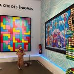 kid friendly art museums in paris - featured is a kid enjoying an exhibition at la musee en herbe